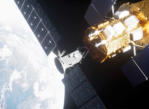 A satellite with large solar panels orbits above Earth.